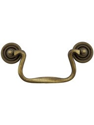 Swan-Neck Brass Bail Pull with Ringed Round Rosettes ‚Äì 4‚Äù Center-to-Center in Antique Brass.